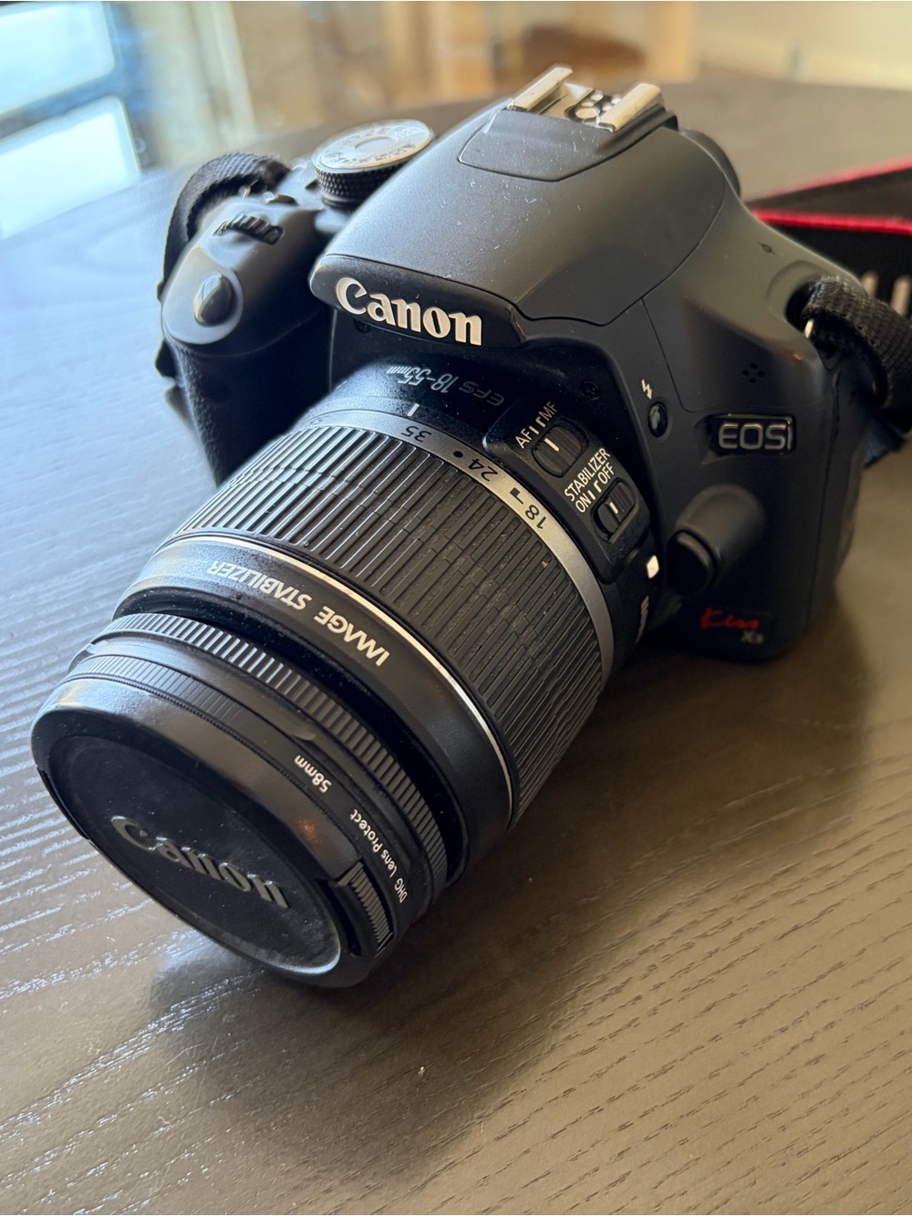 Canon EOS Rebel XSi DSLR Camera in Black with Red-Trim Strap